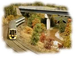 The shape of things to come, a Class 158 heads north under Garry Bridge