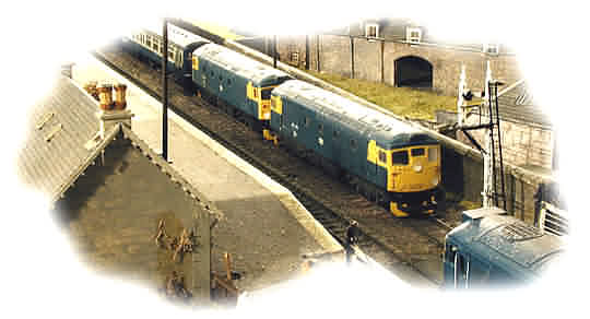 26 043 and 26 036 wait for the "road" with the 08 10 Inverness to Glasgow Queen Street