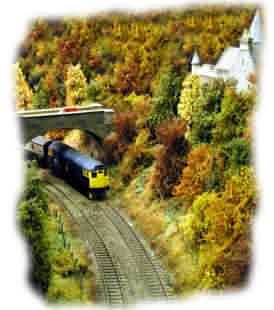 27 005 passing the "West Lodge" with the Inverness-Perth "Vans"