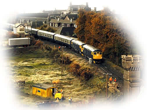 26 031 & 26 040 head south from Blair Atholl with the 08.10 Inverness to Glasgow